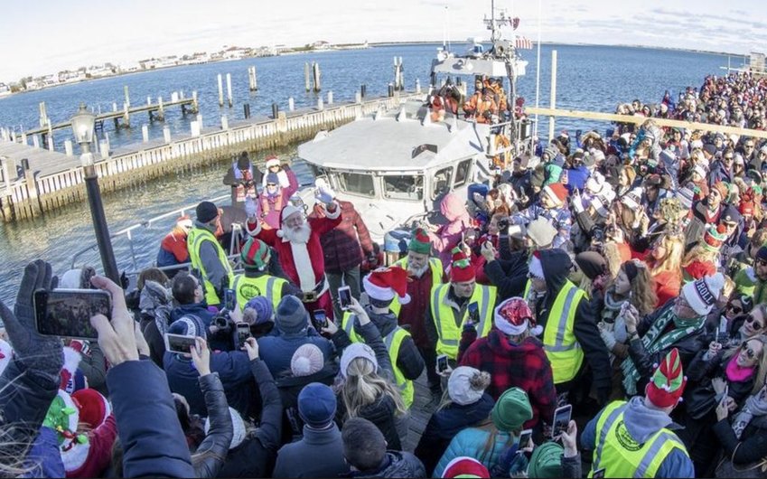 A crowd packs Straight Wharf last year, awaiting the arrival of Santa Claus by Coast Guard patrol boat. This year's Stroll has been canceled due to the ongoing coronavirus panfemic.
