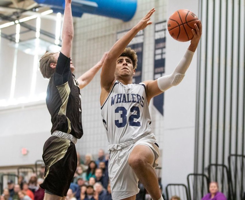 Wilmer Penalo takes the ball to the basket in Nantucket's 66-64 home loss to Westport Monday. Penalo had 15 points in the game.