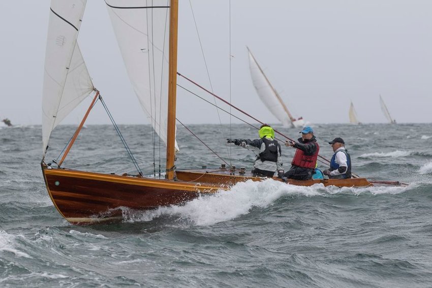 The crew of Scheherazade, overall winner of Sunday's 48th Opera House Cup wooden-boat regatta in the waters off Nantucket, eyes the finish line.