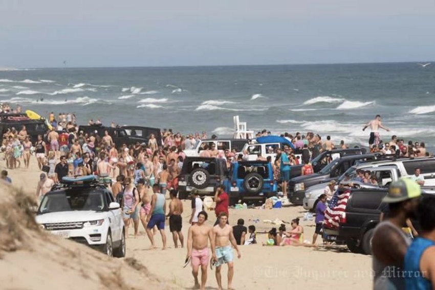 Fourth of July beach scenes like this will not be allowed under coronavirus-related state guidelines that mandate social-distancing, face coverings and other precautions when hitting the sand this summer.