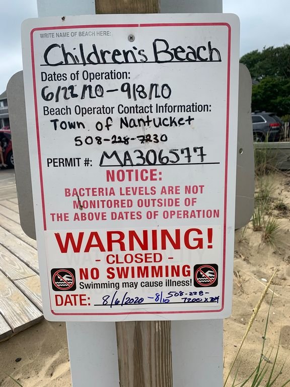 This sign at Children's Beach warns swimmers to stay out of the water due to high bacteria levels.