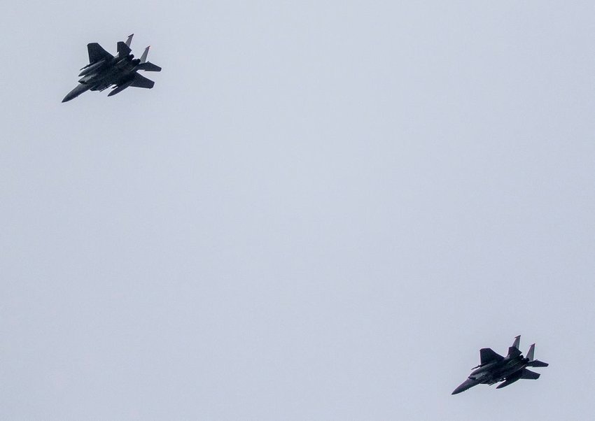 A pair of F-15 fighter jets training over the island Tuesday afternoon.