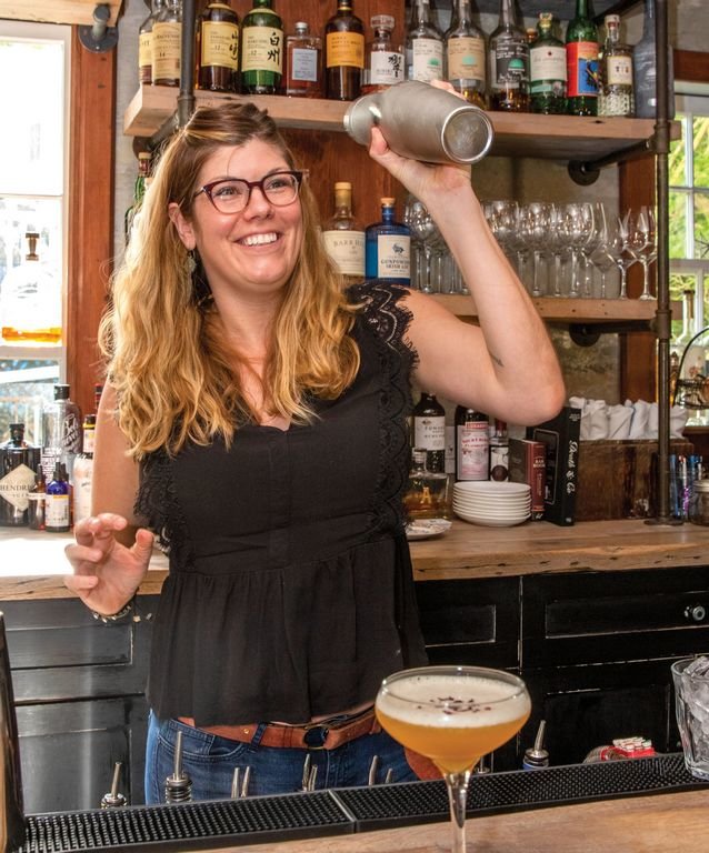 Anna Worgess mixes drinks behind the bar at Proprietors Bar &amp;amp; Table last year. Gov. Charlie Baker recently signed a bill allowing restaurants to sell cocktails to go with take-out orders.