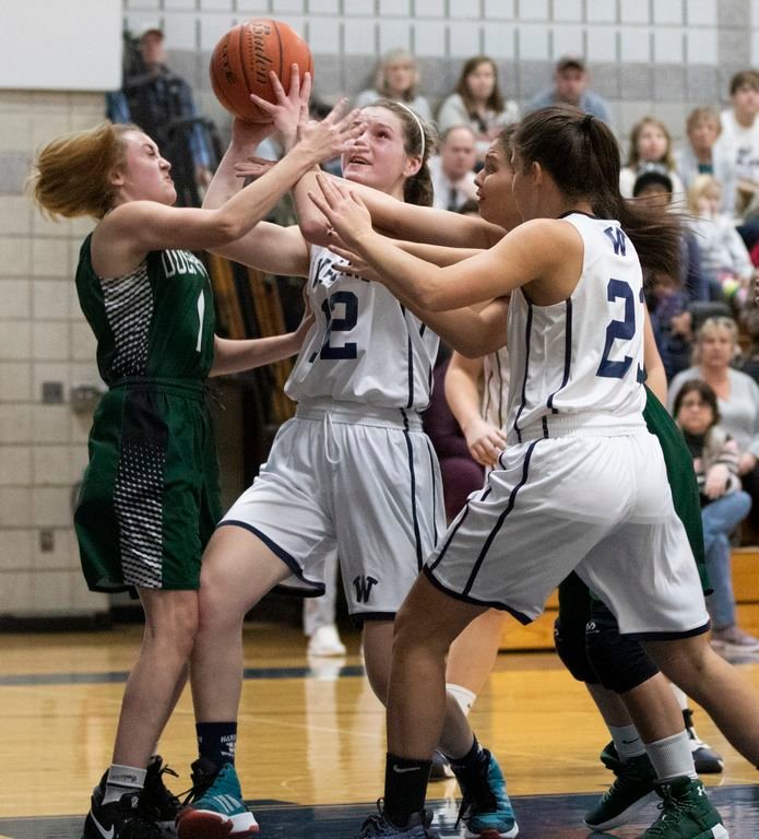 Marina Caspe takes a shot in traffic in Nantucket's 35-30 home win over Dennis-Yarmouth Saturday.