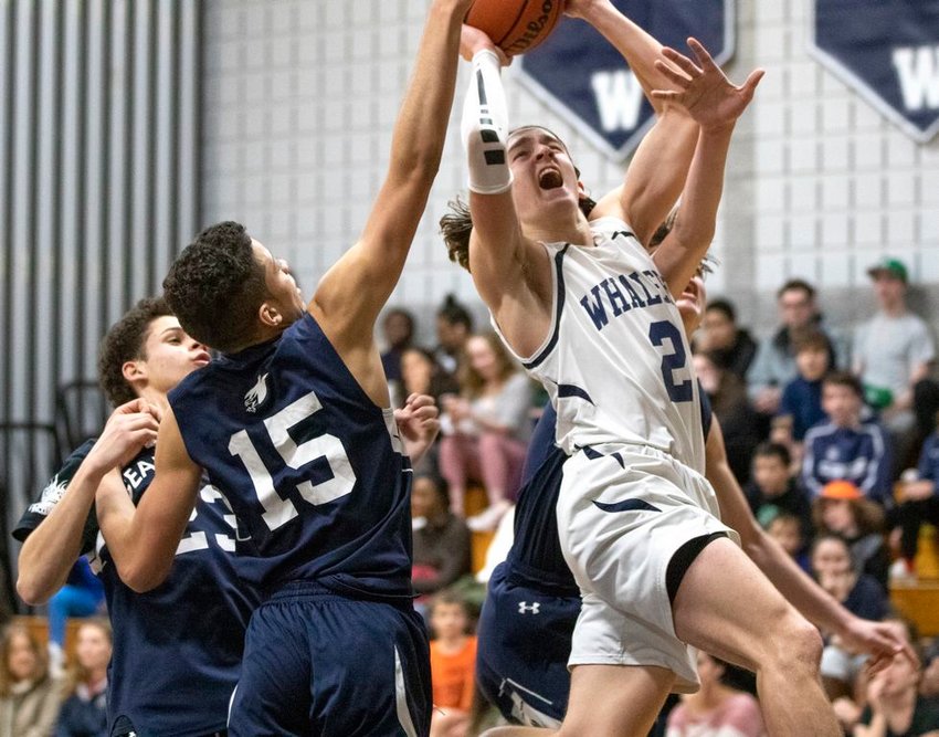 Senior Victor Gamberoni draws the foul going to the basket in the Whaler's 77-56 win over Cape Cod Academy Tuesday.