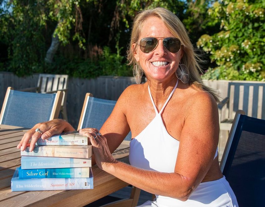 Island author Elin Hilderbrand with a few of her best-selling novels.