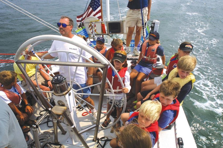 Young sailors on the 12-meter Valiant with Gary Gregory at the helm in 2002.