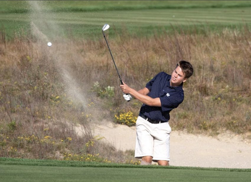 Marsh Hickman hits out of the fairway bunker on the second hole at Miacomet Golf Course against Monomoy earlier this season.
