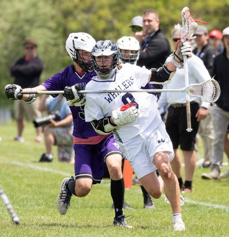 Victor Gamberoni protects the ball in Nantucket's 18-7 home win over Martha's Vineyard Saturday.