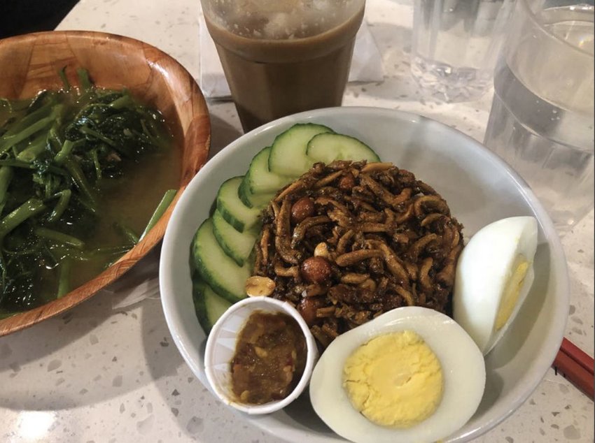 Nasi lemak is a fragrant Malaysian dish of fried crispy anchovies and shallots in a sweet and spicy sambal sauce served over coconut rice with hardboiled eggs, cucumber and cocktail peanuts.