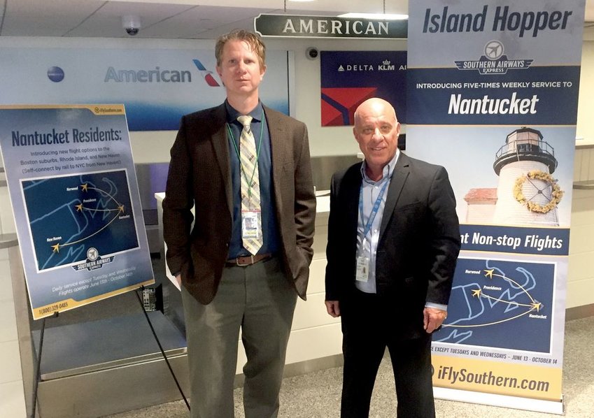 Assistant airport manager Noah Karberg (right) and Southern Airways Express Chief Commercial Officer Mark Cestari (left) at a media event Wednesday announcing new seasonal Southern Airways Express service