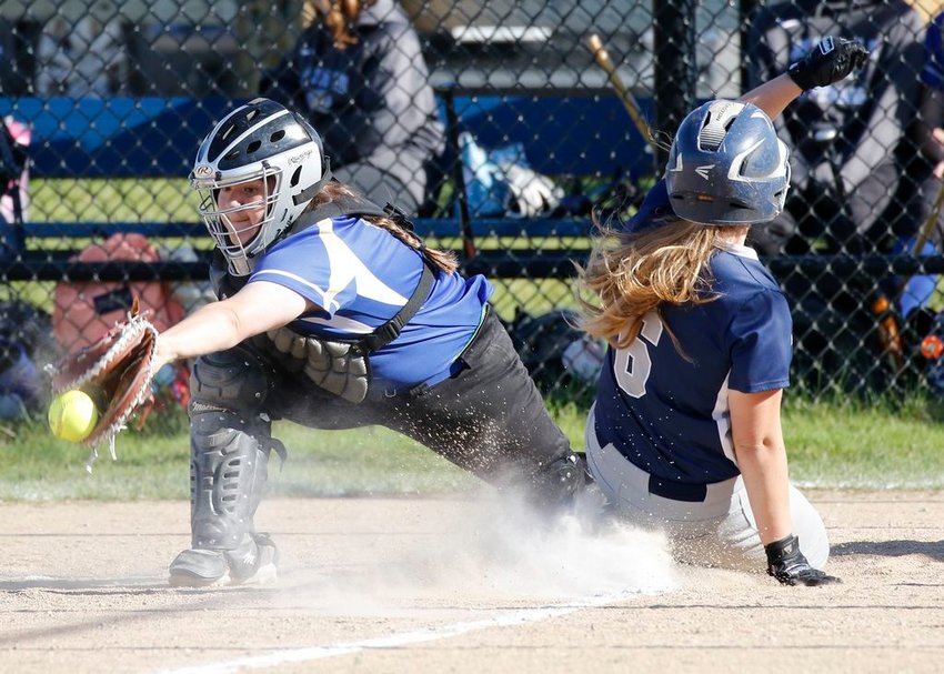 Ava Sharman slides safely into home in the Whalers' 29-4 home win over St. John Paul II last week.