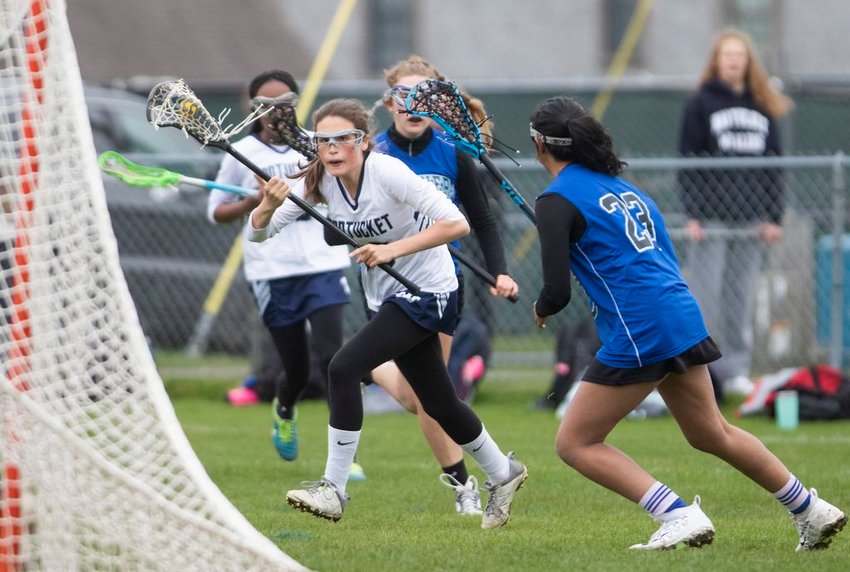 Isobel Congdon looks for an open shot on goal in Nantucket's 12-11 loss to Falmouth Academy Tuesday.