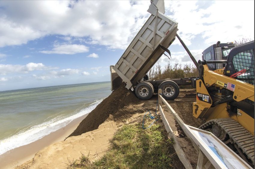 The Sconset Beach Preservation Fund replenishes sand on its erosion-control project at the base of the Sankaty Bluff.