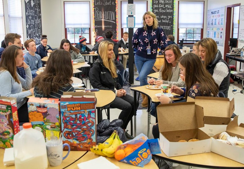 Teacher Liz Reinemo addresses a group of students participating in the Harvey Foundation's M.E.A.L. Program breakfast in Adriene Lombardi's classroom Friday morning before the start of school.