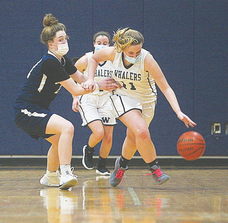 Sydney King drives past a Sandwich defender in a 56-28 home loss Tuesday.