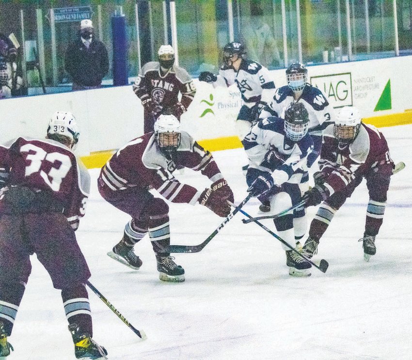 Camden Knapp is sandwiched by Bishop Stang defenders in Nantucket&rsquo;s 5-1 home loss Monday.