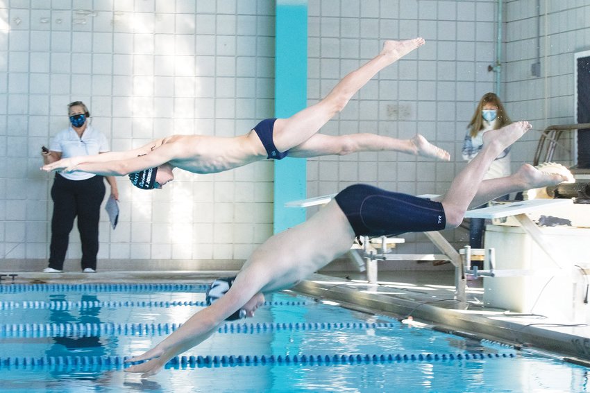 Jake Johnson and Cameron Christie dive into the pool during a virtual meet earlier this season.