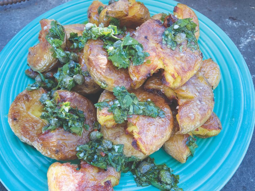 Smashed potatoes crisped in the oven and topped off with a vibrant salsa verde are an excellent party food.