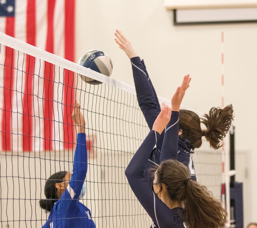 Amelie Roberts block a Mashpee hit. The final home game of the season is today at 4 p.m. against Rising Tide.