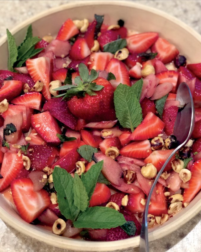 This unusual salad gets its vibrancy from combining raw slices of macerated rhubarb with fresh strawberries, mint and toasted hazelnuts.