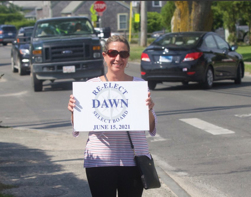 Incumbent Select Board chair Dawn Holdgate campaigns near the Nantucket High School polls Tuesday.