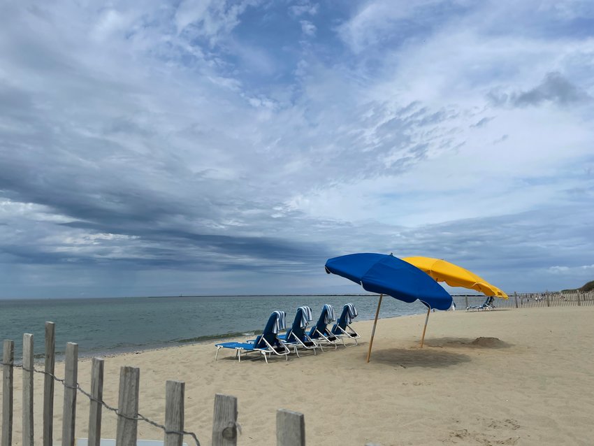 Umbrellas and chairs at Cliffside Beach await beach-goers.