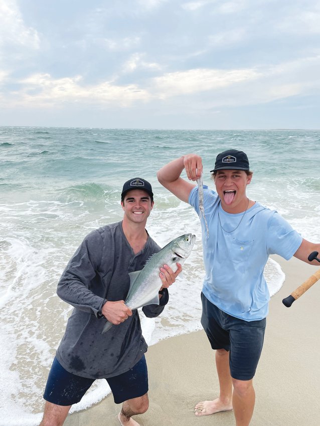 Brooks Gammill and Mac Deane with a bluefish they caught at Smith's Point Saturday.