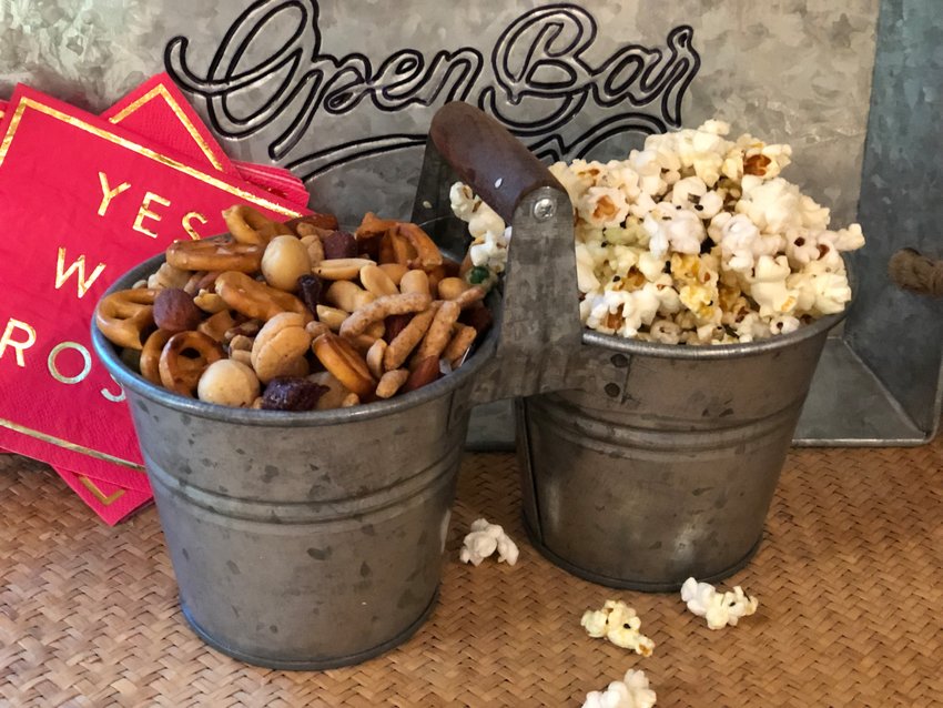 Lina&rsquo;s Parisian Popcorn, right, is seasoned with nutritional yeast and spicy togarashi. Whole almonds and pecans serve as the base for David Lebovitz&rsquo;s Spicy Glazed Nut and Pretzel Mix, left.
