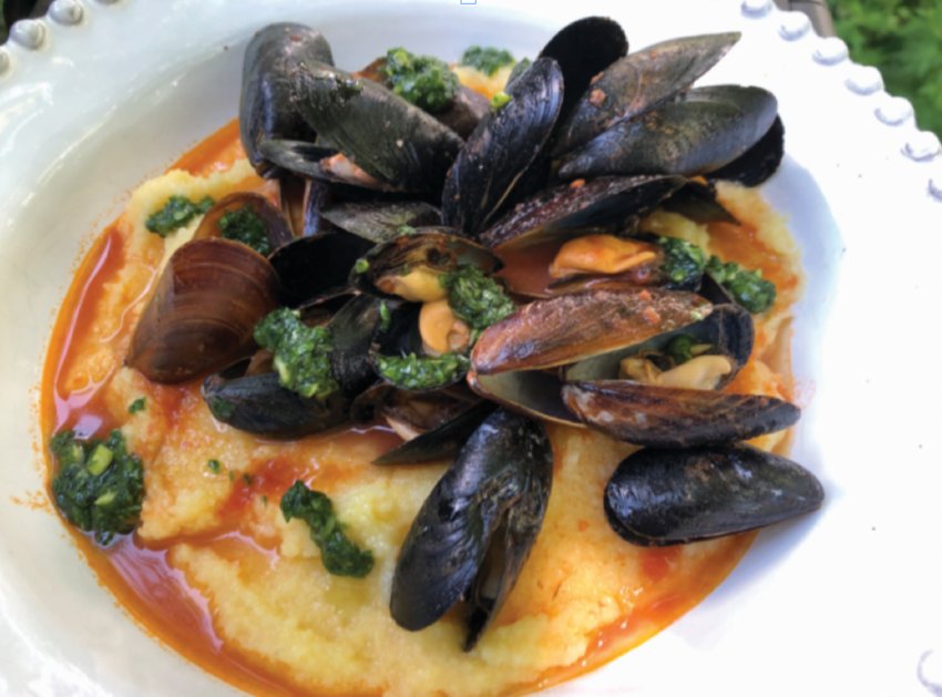 Mussels with spicy tomato sauce and pesto over polenta.