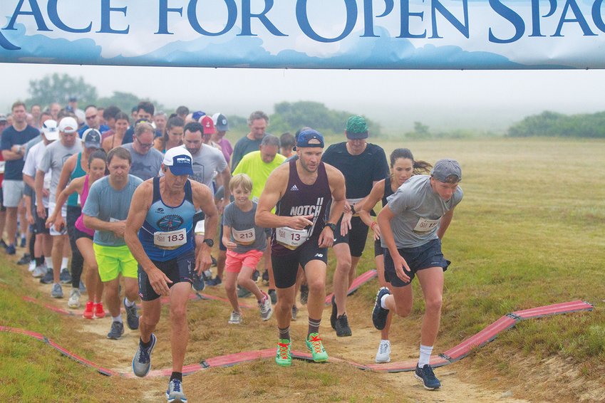 Runners at the start of the Nantucket Conservation Foundation&rsquo;s Race for Open Space 5K Saturday at the Milestone Cranberry Bog.