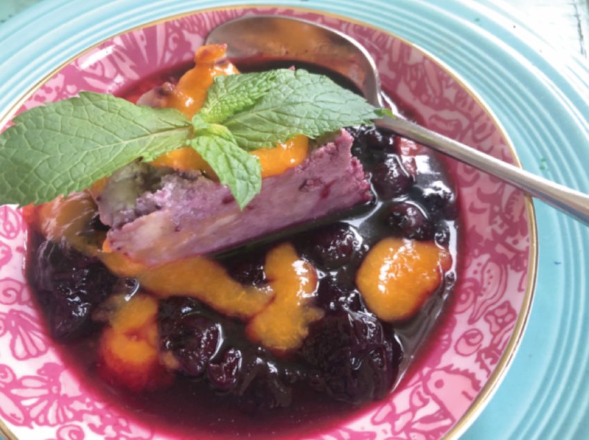 Mixed berry noodle pudding with blueberry sauce and apricot butter is best served warm from the oven or chilled.
