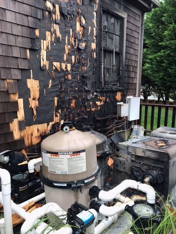 Fire believed to have started in pool-operating equipment damaged the exterior of a Hedgebury Lane guest cottage early Thursday morning.