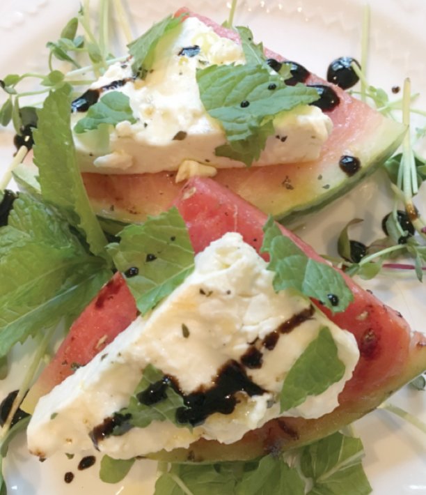 A drizzle of balsamic vinegar and some fresh mint leaves heighten the flavor of this Grilled Watermelon and Feta Salad.
