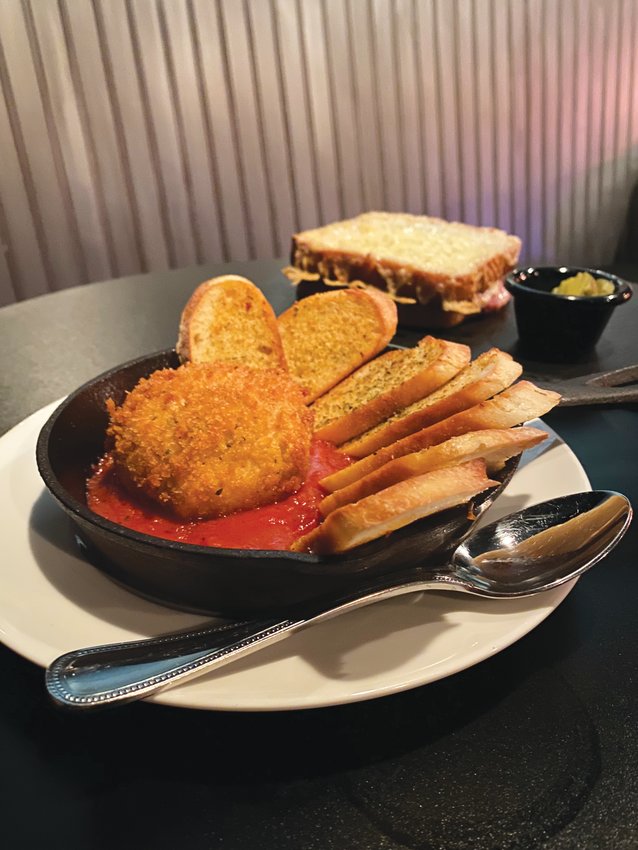 Petrichor&rsquo;s take on a burrata plate, front, is fried burrata in marinara with garlic crostini. The croque monsieur, back, is made with Black Forest ham and Gruyere on country bread.
