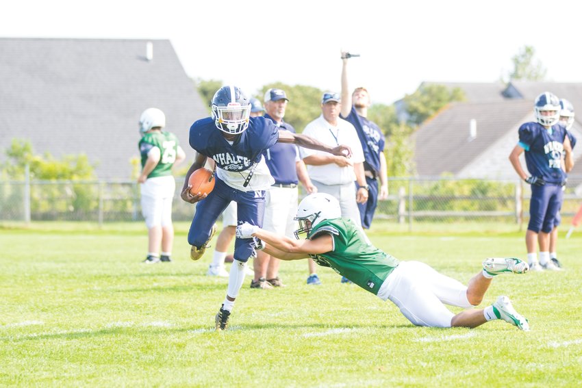 Justin Bloise breaks out of a North Reading tackle during Saturday&rsquo;s scrimmage.