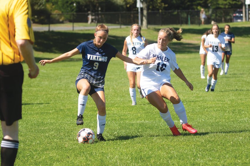 Cydney Mosscrop challenges an East Bridgewater player for the ball in Nantucket&rsquo;s 6-0 loss to the Vikings at home Saturday.