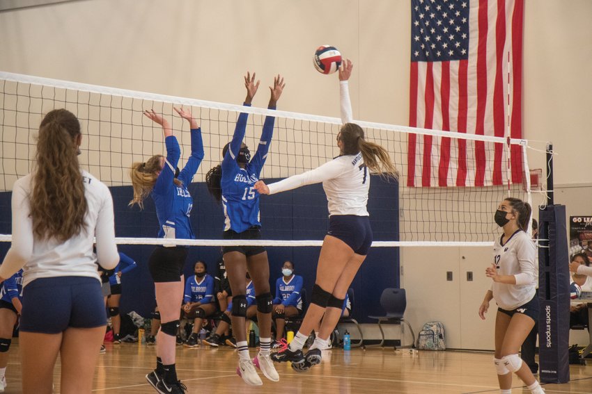 Kalina Natcheva tips the ball over the net against Holbrook Saturday. Nantucket won the match in four sets.