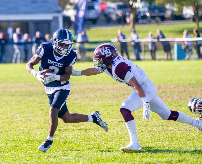 Makai Bodden attempts to shed a tackle in open space in Nantucket's 14-6 loss to West Bridgewater Saturday.