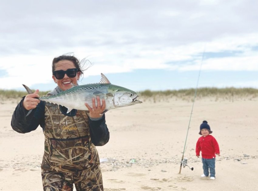 Marleah Lydon and her son Beau with a false albacore she caught from the beach.
