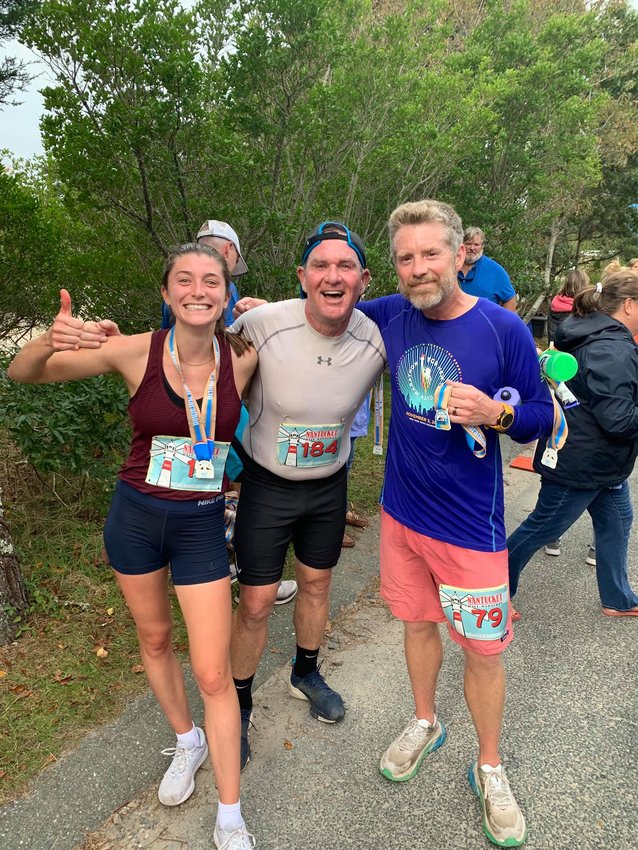 From left, Brianna Bisson, Scott Capizzo and Tucker Holland at the 2021 Nantucket Half Marathon.