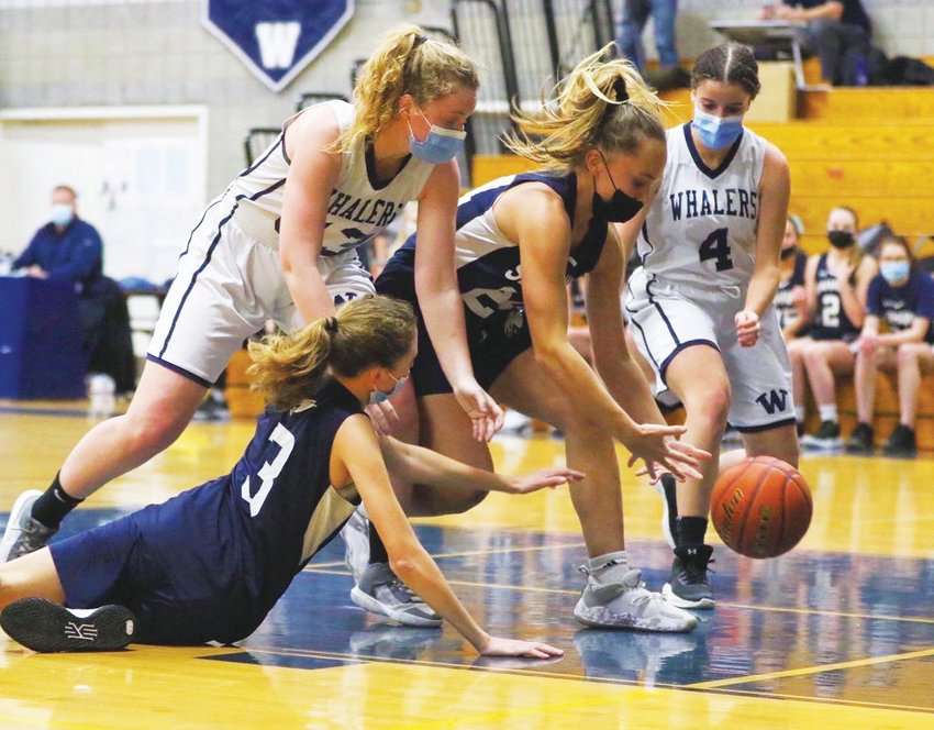 Maclaine Willett, left, and Raegan Perry (4) battle for a loose ball.