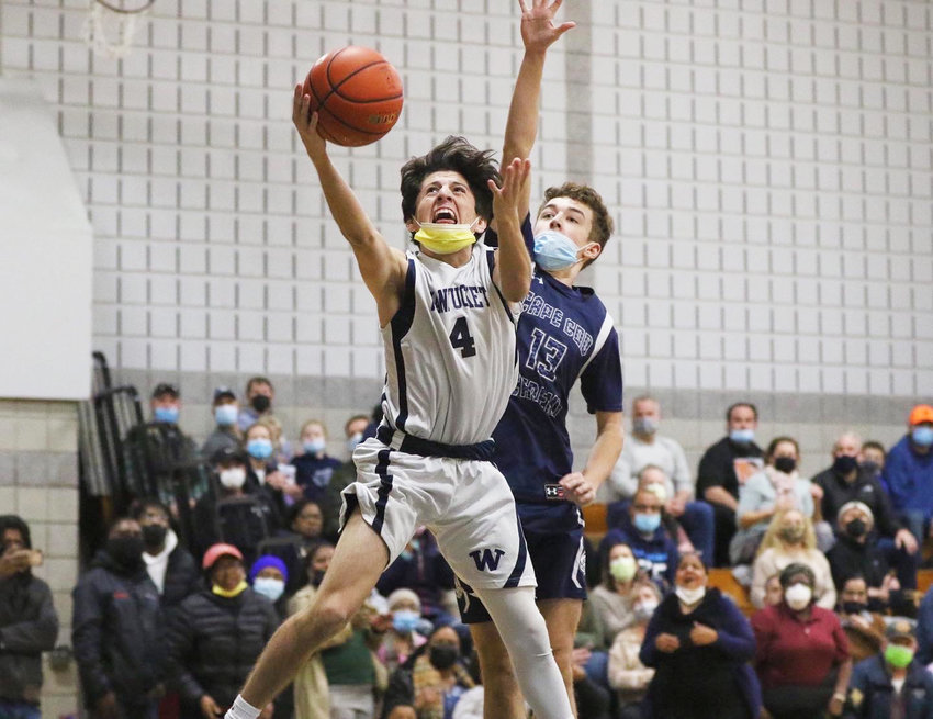 Carlos Aguilar drives to the hoop in Tuesday's 67-65 loss to Cape Cod Academy.