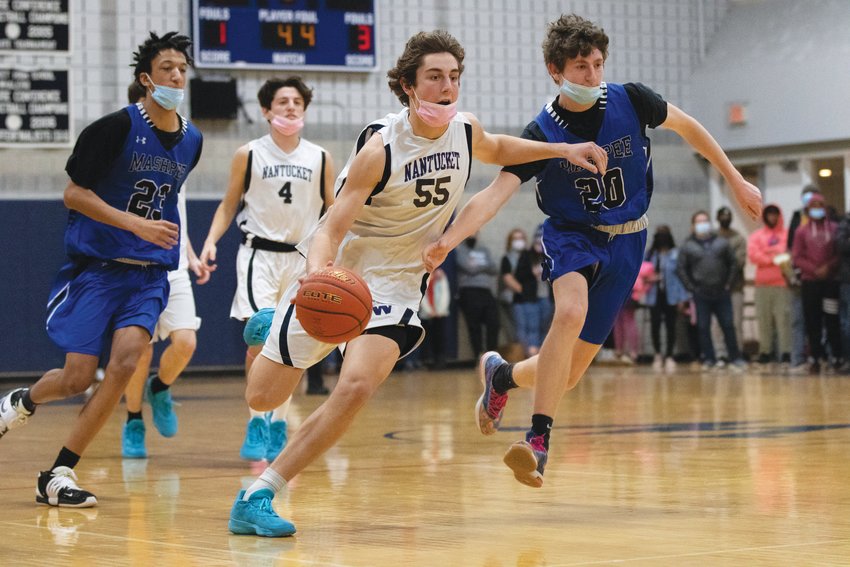 Jack Halik runs the fast break between a pair of Mashpee defenders in Friday&rsquo;s 52-29 Whalers&rsquo; win.