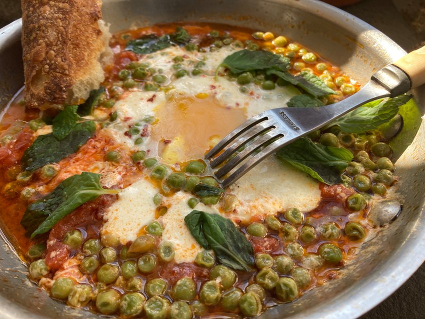 Frozen peas and canned tomatoes star in Eggs alla Bruna, a savory dish for supper.