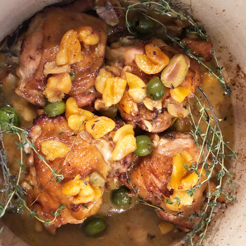 Braised Chicken Thighs with Apricots, Garlic, Olives and Fresh Thyme is a colorful and tasty addition to your spring menu.