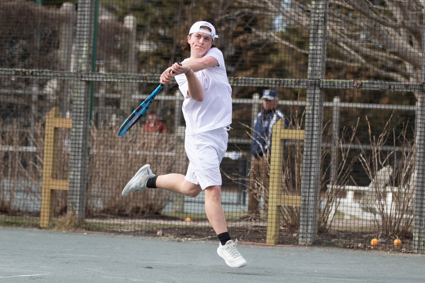 The Whalers&rsquo; top singles player Evan Belanger leaps for a return.