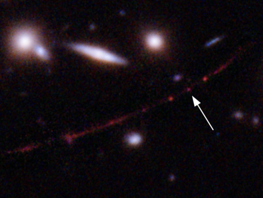 Earendel&rsquo;s host galaxy was first discovered as a result of passing through a foreground gravitational lens, its light is stretched out into a thin, red colored arc called the Sunrise Arc.
