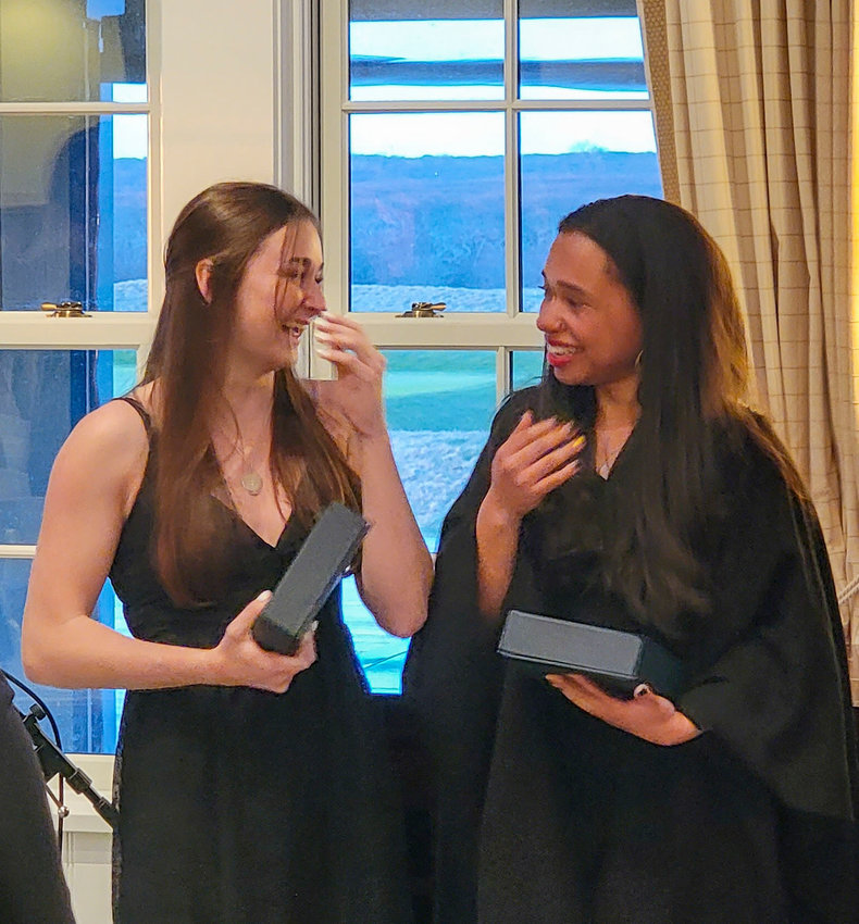 Sarah Hanlon and Maryann Vasquez-Cruz celebrate moments after being named the Nantucket Scholars.