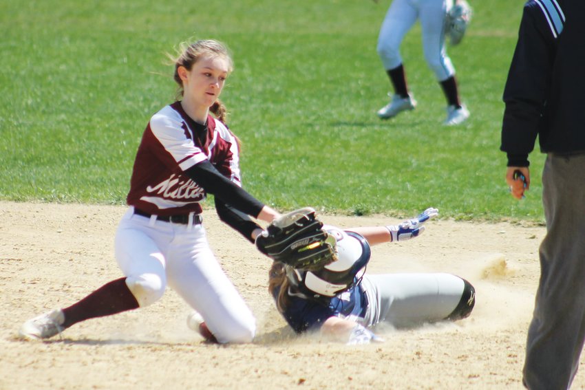 Melanie Bamber slides under the tag of the Millis second baseman in last Wednesday&rsquo;s 11-3 loss.